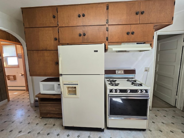kitchen with light floors, a baseboard radiator, under cabinet range hood, white appliances, and arched walkways