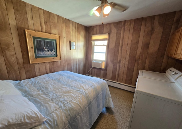 bedroom featuring washer and clothes dryer, carpet flooring, cooling unit, a baseboard heating unit, and wooden walls