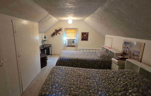 bedroom with cooling unit, a textured ceiling, lofted ceiling, and carpet floors