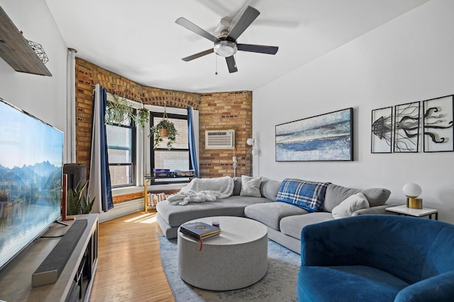 1204 Harmon Pl Unit 18, Minneapolis, MN 55403 - living area featuring a ceiling fan, light wood finished floors, and a wall unit AC