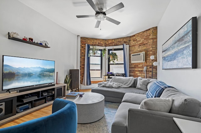 1204 Harmon Pl Unit 18, Minneapolis, MN 55403 - living room featuring ceiling fan, a wall mounted air conditioner, and brick wall