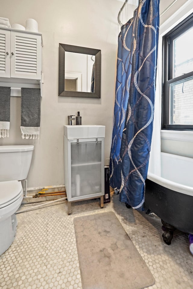1204 Harmon Pl Unit 18, Minneapolis, MN 55403 - bathroom with toilet, a bath, vanity, and a shower with curtain