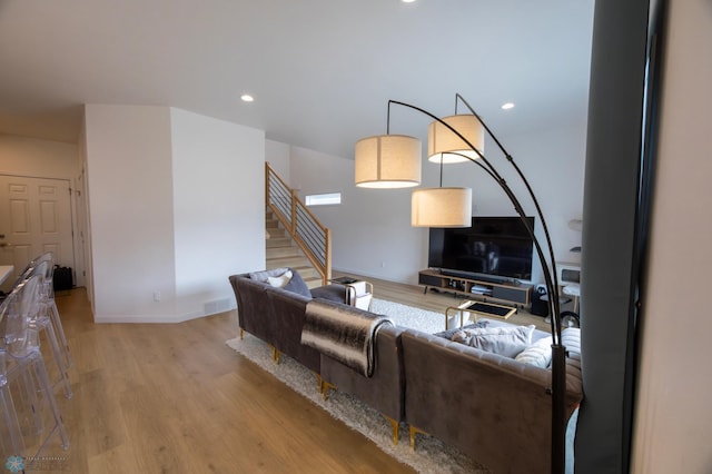 4964 Big Goose Ln S, Fargo, ND 58104 - living room with light wood-style flooring, stairs, baseboards, and recessed lighting