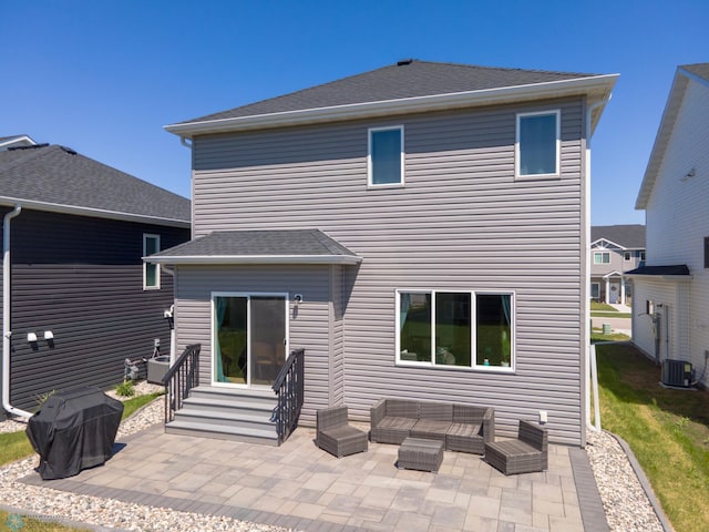 4964 Big Goose Ln S, Fargo, ND 58104 - back of house with a patio, central air condition unit, entry steps, an outdoor hangout area, and roof with shingles