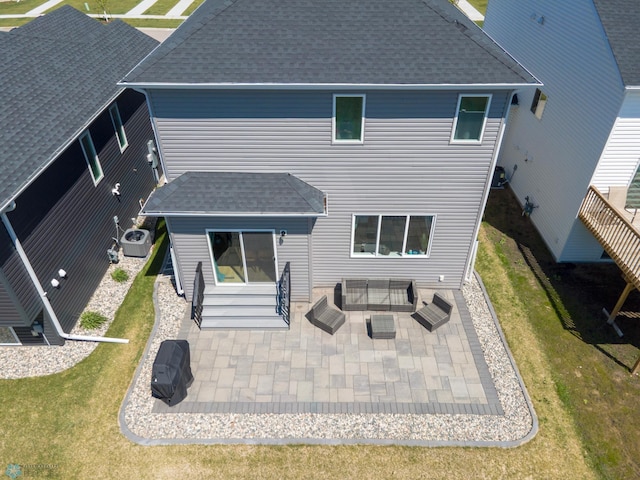 4964 Big Goose Ln S, Fargo, ND 58104 - back of house with roof with shingles, a patio, entry steps, and a yard