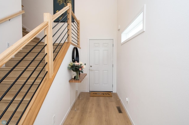4964 Big Goose Ln S, Fargo, ND 58104 - entryway with wood finished floors, baseboards, stairs, and a towering ceiling