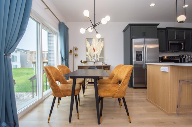 4964 Big Goose Ln S, Fargo, ND 58104 - dining area with light wood-style floors and a chandelier