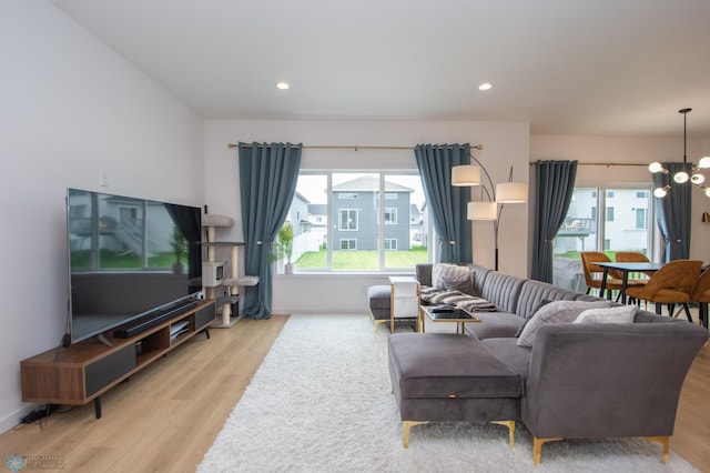 4964 Big Goose Ln S, Fargo, ND 58104 - living area featuring wood finished floors, a chandelier, and recessed lighting