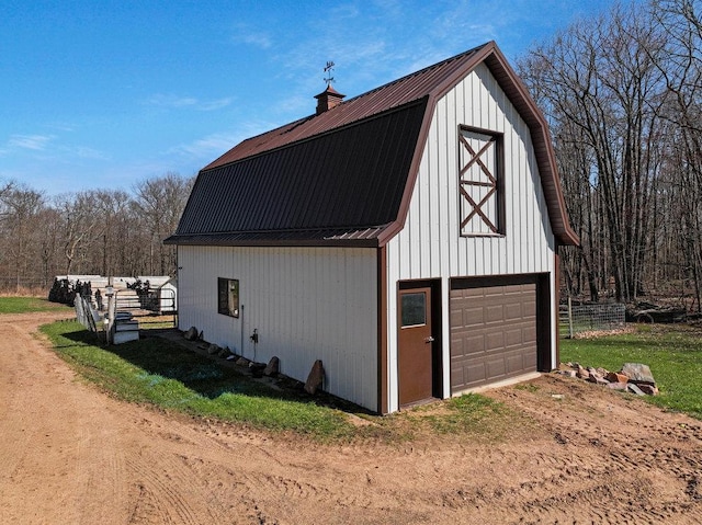 exterior space featuring driveway and a detached garage