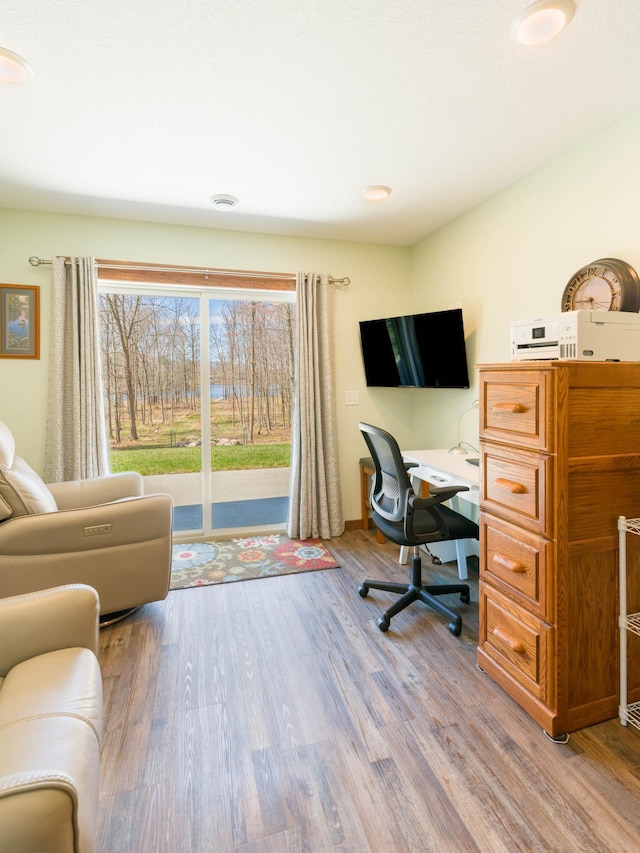 home office with light wood-style floors