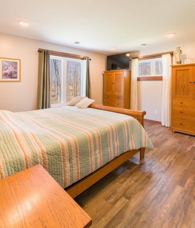bedroom featuring wood finished floors