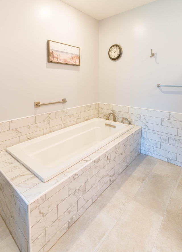 full bathroom featuring a garden tub and tile patterned floors