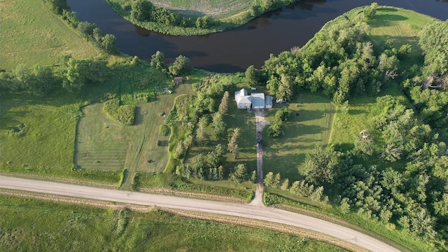 aerial view of property's location with a large body of water
