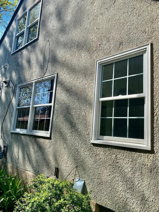 view of property exterior with stucco siding