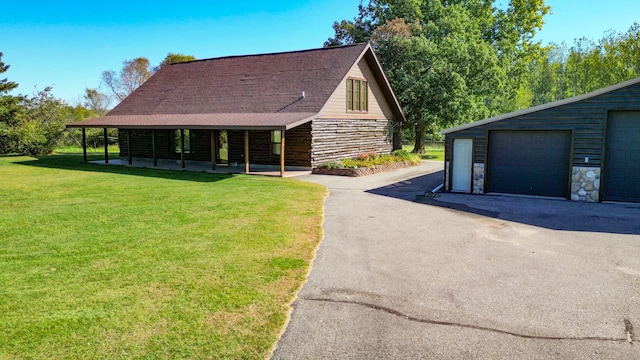 view of home's exterior with a yard, an outbuilding, covered porch, a shingled roof, and stone siding