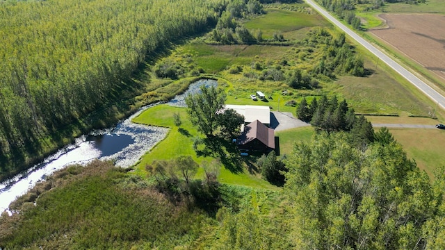 aerial view with a water view, a rural view, and a view of trees