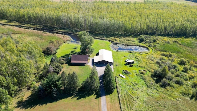 bird's eye view with a water view and a view of trees