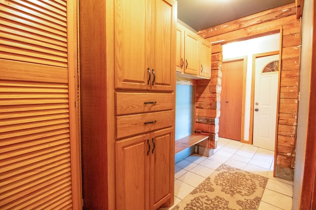 mudroom with light tile patterned floors