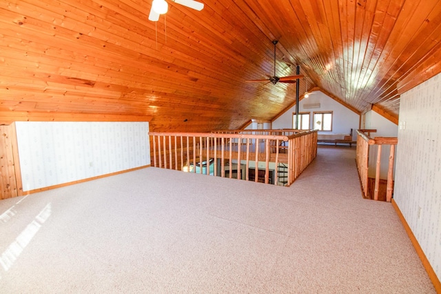 additional living space with carpet flooring, wood ceiling, lofted ceiling, and a ceiling fan