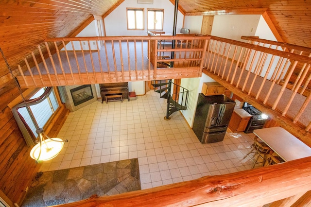 interior space featuring lofted ceiling, wood ceiling, and tile patterned floors