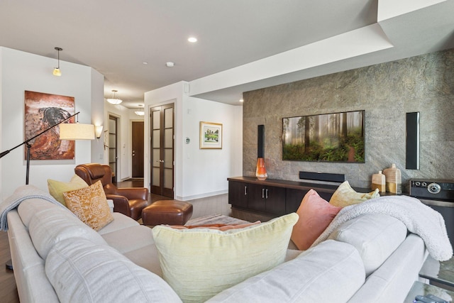 living room with baseboards, recessed lighting, and wood finished floors