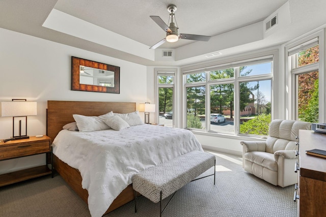 bedroom featuring visible vents, carpet flooring, and baseboards
