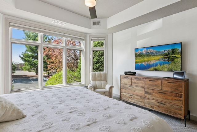 bedroom featuring baseboards, carpet, and visible vents
