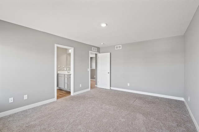 11263 131st Cir N, Dayton, MN 55327 - unfurnished bedroom featuring carpet flooring, baseboards, recessed lighting, and connected bathroom