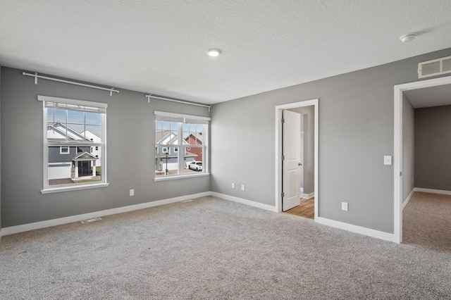 11263 131st Cir N, Dayton, MN 55327 - unfurnished bedroom with carpet floors, a textured ceiling, and baseboards