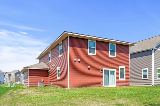 11263 131st Cir N, Dayton, MN 55327 - rear view of house with a lawn and central AC unit