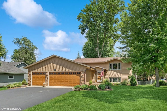 17150 Grenadier Ave, Lakeville, MN 55044 - view of front of property with an attached garage, a front lawn, and asphalt driveway