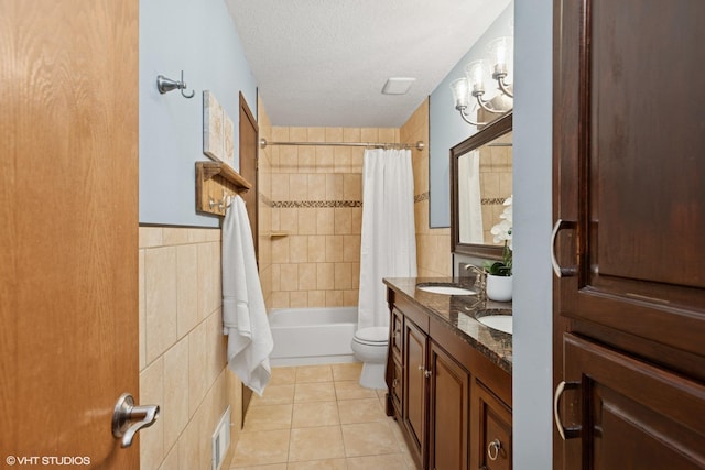 17150 Grenadier Ave, Lakeville, MN 55044 - bathroom featuring shower / bath combination with curtain, tile patterned flooring, double vanity, tile walls, and a textured ceiling