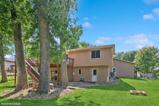 17150 Grenadier Ave, Lakeville, MN 55044 - rear view of house featuring a wooden deck, a lawn, and stairs