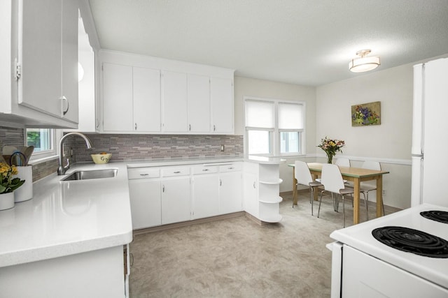 1677 Niles Ave, Saint Paul, MN 55116 - kitchen with white appliances, light countertops, decorative backsplash, and white cabinets