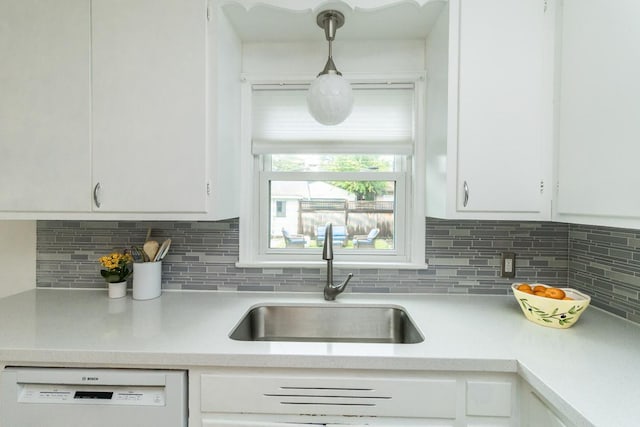 1677 Niles Ave, Saint Paul, MN 55116 - kitchen with white dishwasher, light countertops, and white cabinetry