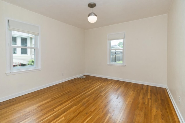 1677 Niles Ave, Saint Paul, MN 55116 - empty room featuring light wood finished floors and baseboards