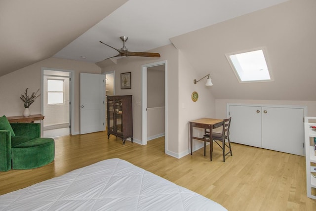 1677 Niles Ave, Saint Paul, MN 55116 - bedroom featuring vaulted ceiling, light wood-type flooring, a skylight, and ceiling fan