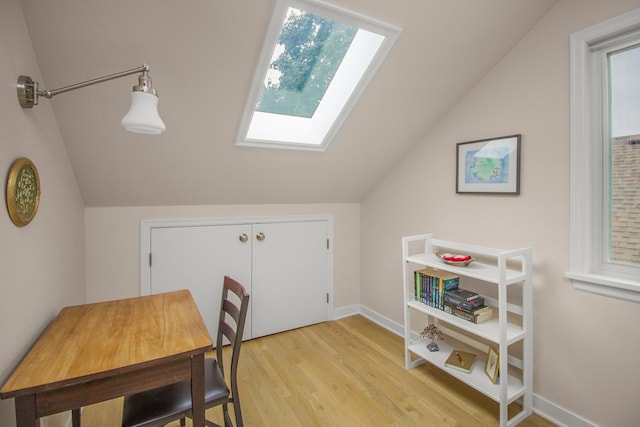 1677 Niles Ave, Saint Paul, MN 55116 - office space featuring a skylight, lofted ceiling, and light wood-type flooring