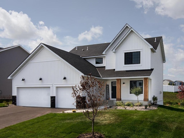 modern inspired farmhouse featuring an attached garage, covered porch, board and batten siding, and concrete driveway