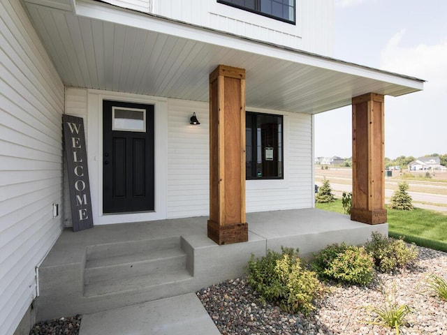 doorway to property with covered porch