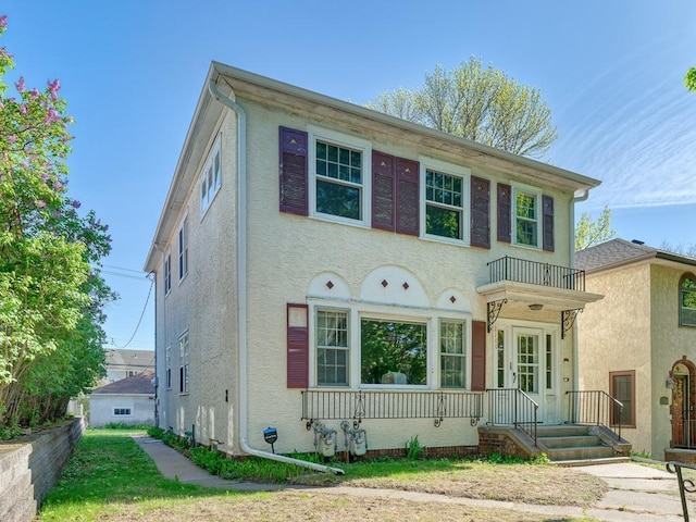 2100 Saint Clair Ave, Saint Paul, MN 55105 - view of front of home with stucco siding and a balcony