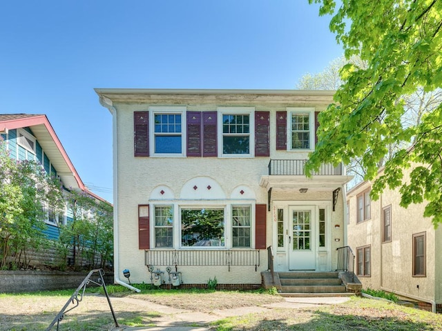 2100 Saint Clair Ave, Saint Paul, MN 55105 - view of front facade featuring entry steps and stucco siding