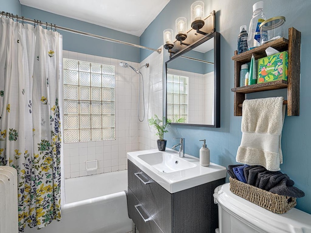 2100 Saint Clair Ave, Saint Paul, MN 55105 - full bathroom featuring radiator heating unit, shower / tub combo with curtain, toilet, and vanity