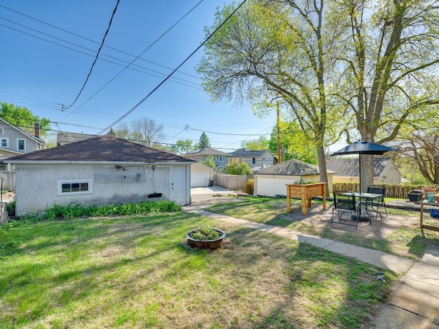 2100 Saint Clair Ave, Saint Paul, MN 55105 - view of yard with an outdoor structure and a detached garage