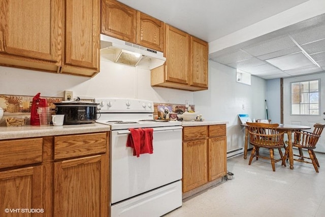 904 Washington St, Saint Croix Falls, WI 54024 - kitchen with baseboard heating, light countertops, white range with electric cooktop, brown cabinetry, and under cabinet range hood