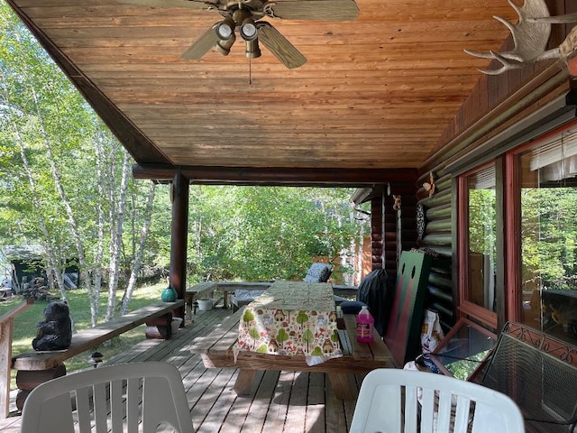 wooden deck featuring a ceiling fan