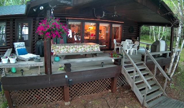 wooden terrace with stairs and ceiling fan