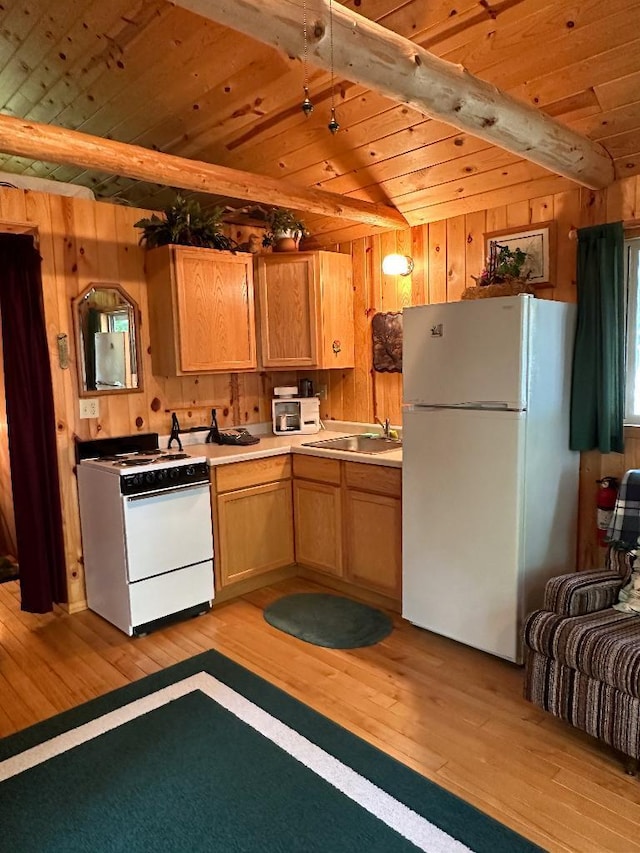 kitchen with a sink, wood ceiling, white appliances, and light wood-style flooring
