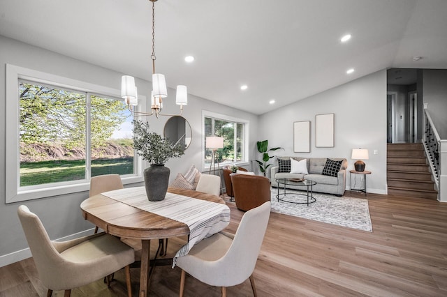 dining area featuring stairway, lofted ceiling, recessed lighting, light wood-type flooring, and baseboards