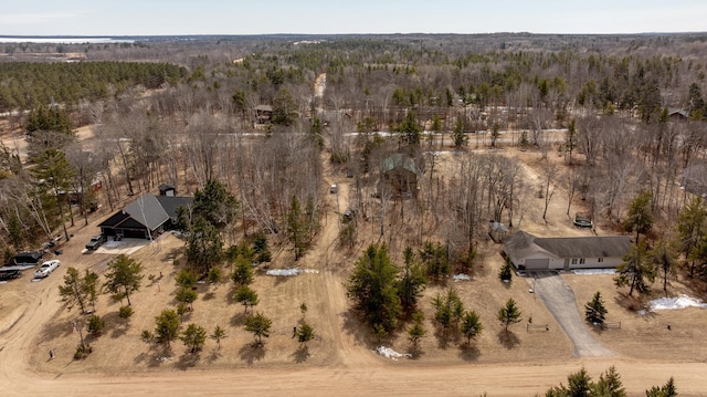 aerial view featuring a wooded view